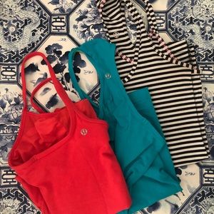 Trio of Lululemon work out tanks.